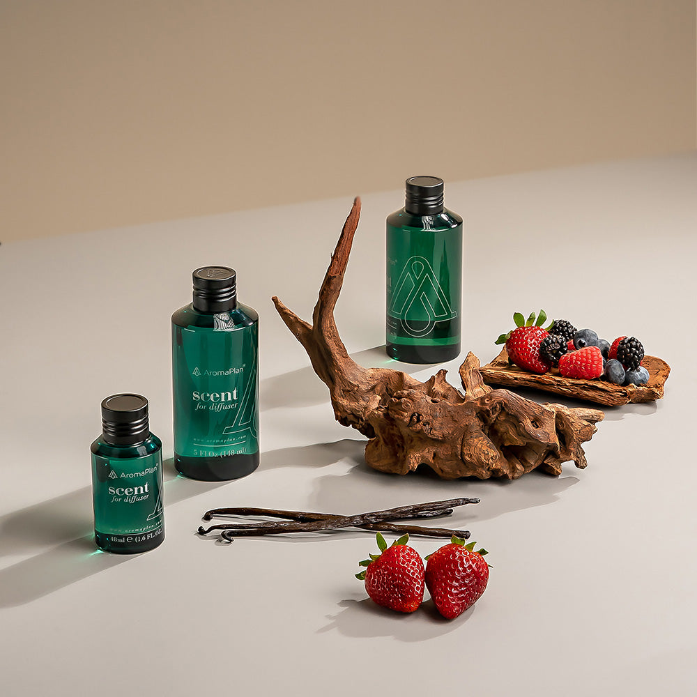 A sleek, compact diffuser with a sophisticated design, placed on a smooth, modern surface in an elegantly styled environment.